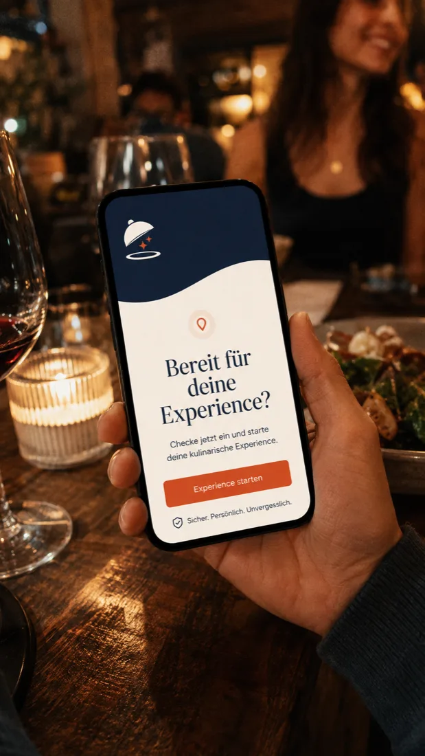 A phone held up at a candlelit restaurant table shows the TSTE app inviting the user to start an experience.